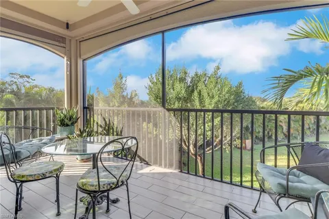 a view of a chairs and table in patio