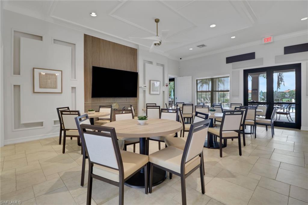26233 Palace Lane, Unit 201 Bonita Springs, FL 34135 - Photo 33 of 46 a view of a dining room with furniture