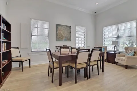 a view of a a dining room with furniture window and outside view