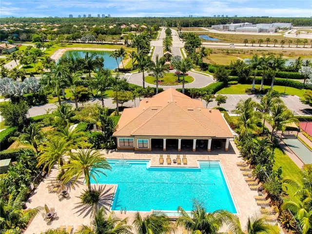 a view of a swimming pool and lounge chair