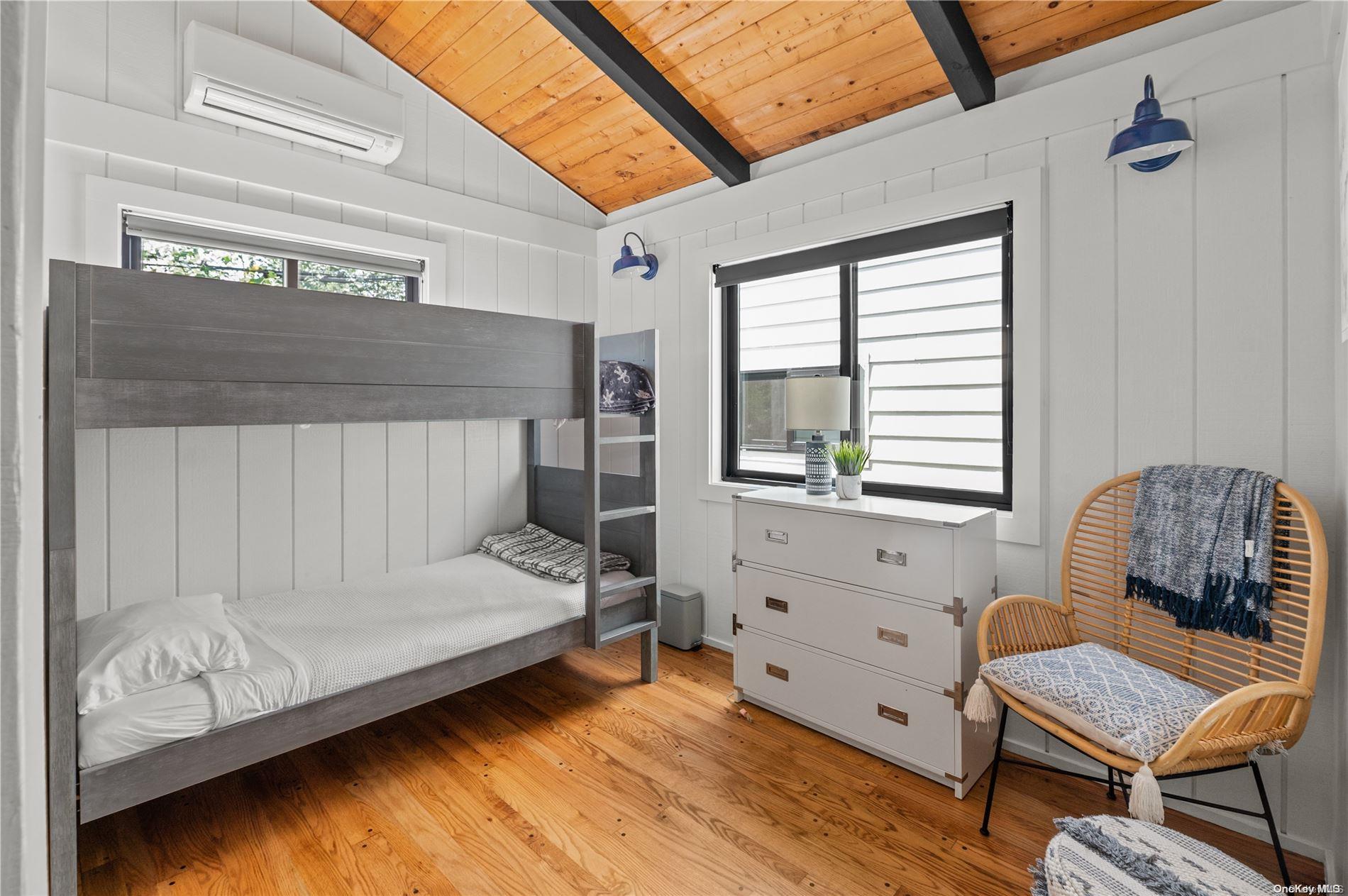 220 Cottage Walk Ocean Beach, NY 11770 - Photo 12 of 32 a bedroom with a bed and a window