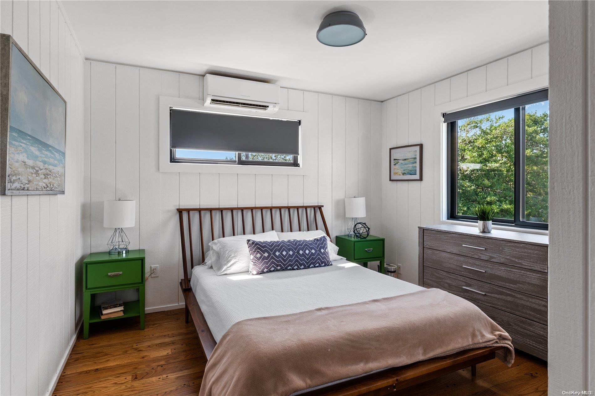 220 Cottage Walk Ocean Beach, NY 11770 - Photo 15 of 32 a bedroom with a bed and a window