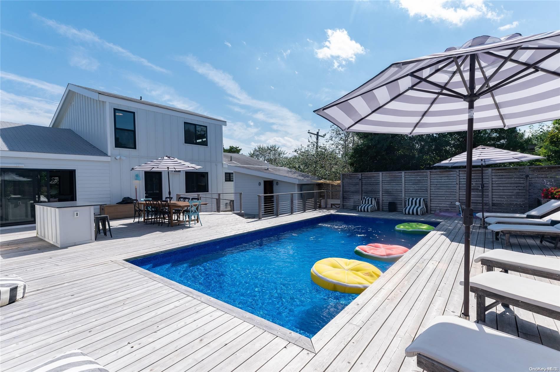 220 Cottage Walk Ocean Beach, NY 11770 - Photo 23 of 32 a view of a swimming pool with a patio