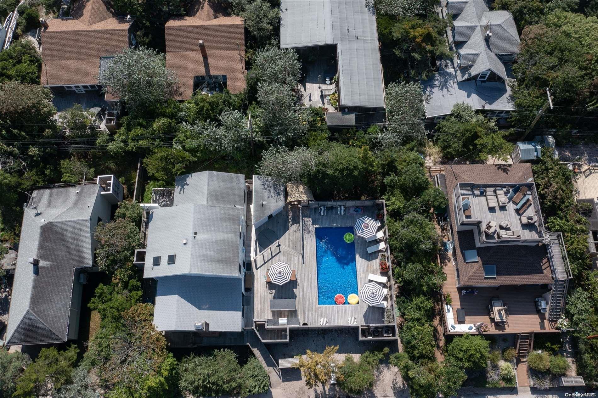 220 Cottage Walk Ocean Beach, NY 11770 - Photo 4 of 32 an aerial view of residential houses with outdoor space