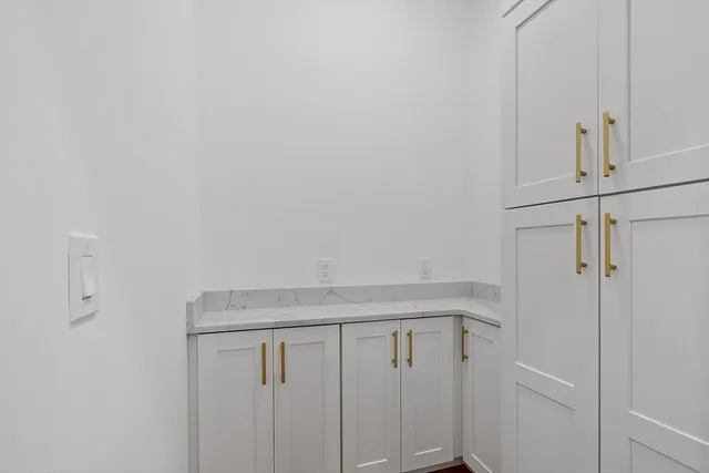 a kitchen with a sink stove and refrigerator