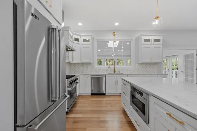 a kitchen with a sink and cabinets