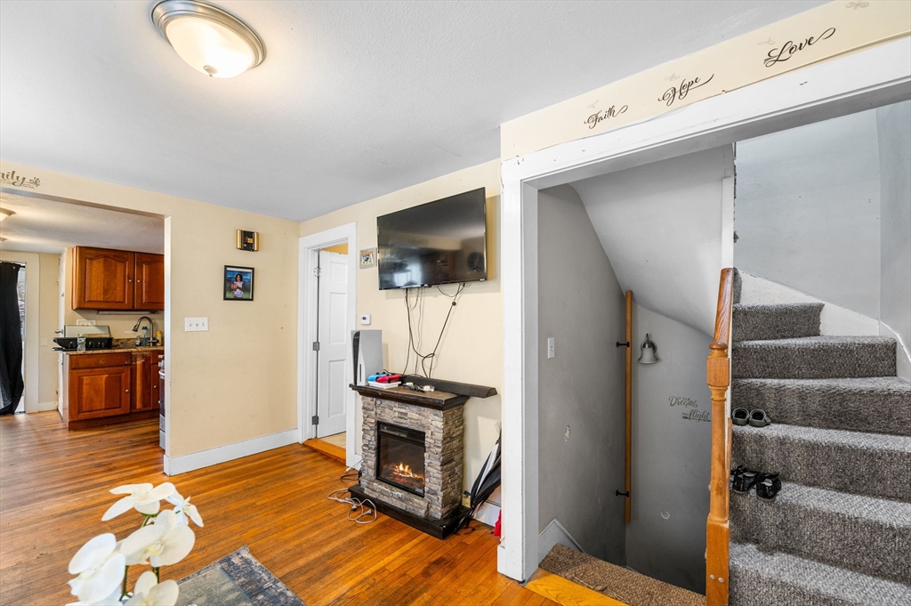 27 Appleton Street Salem, MA 01970 - Photo 15 of 31 a view of a livingroom with wooden floor and a flat screen tv