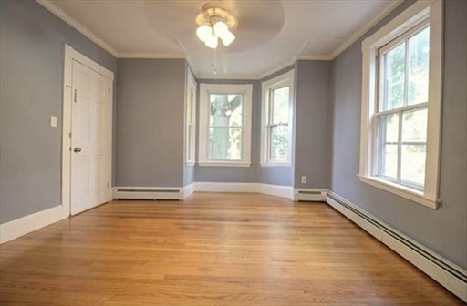 27 Appleton Street Salem, MA 01970 - Photo 27 of 31 a view of an empty room with wooden floor and a window