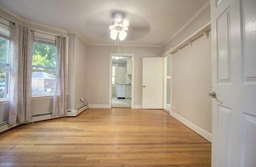 27 Appleton Street Salem, MA 01970 - Photo 28 of 31 a view of an empty room with wooden floor and a window