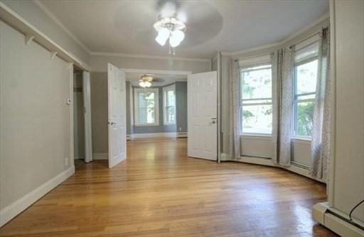 27 Appleton Street Salem, MA 01970 - Photo 29 of 31 an empty room with wooden floor and windows