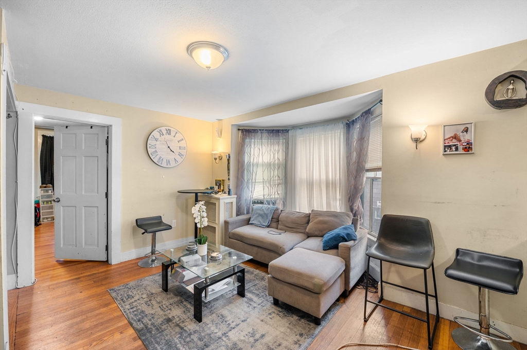 27 Appleton Street Salem, MA 01970 - Photo 4 of 31 a living room with furniture and wooden floor