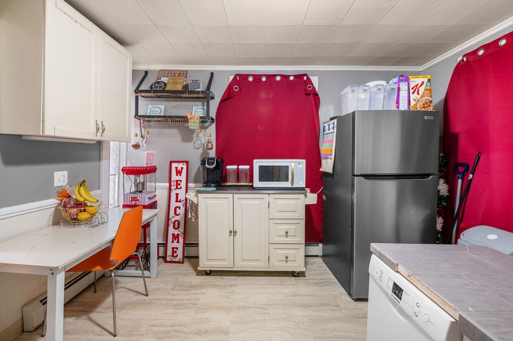 27 Appleton Street Salem, MA 01970 - Photo 8 of 31 a utility room with cabinets and appliances