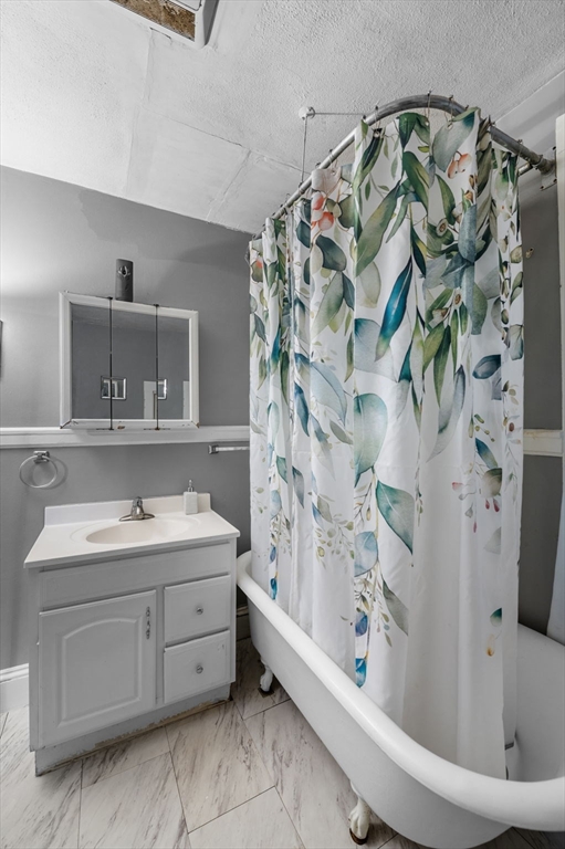 27 Appleton Street Salem, MA 01970 - Photo 9 of 31 a bathroom with a sink a toilet and shower