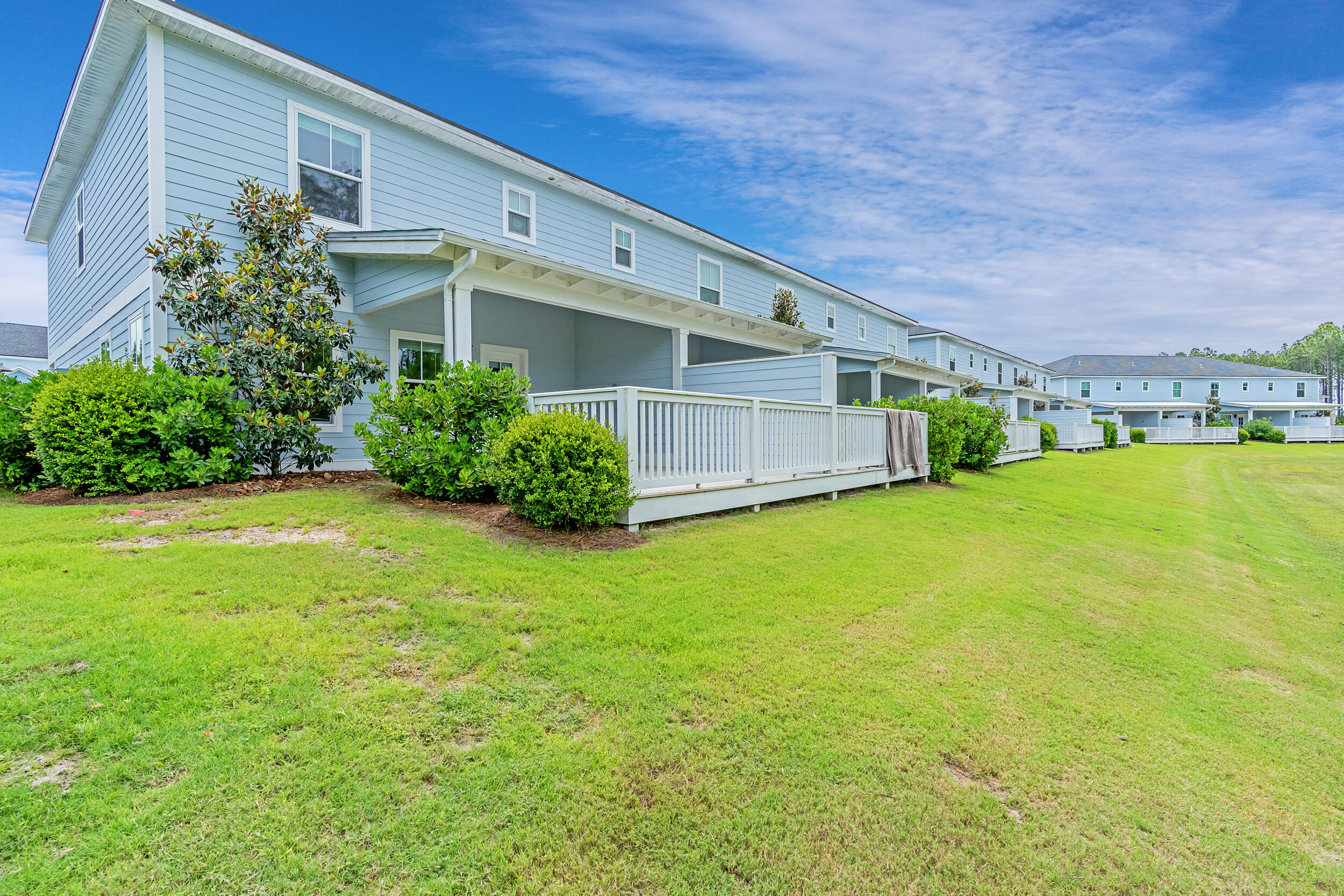 46 Golden Bell Ct Inlet Beach, Unit 46A Inlet Beach, FL 32461 - Photo 5 of 48 a front view of a house with a yard