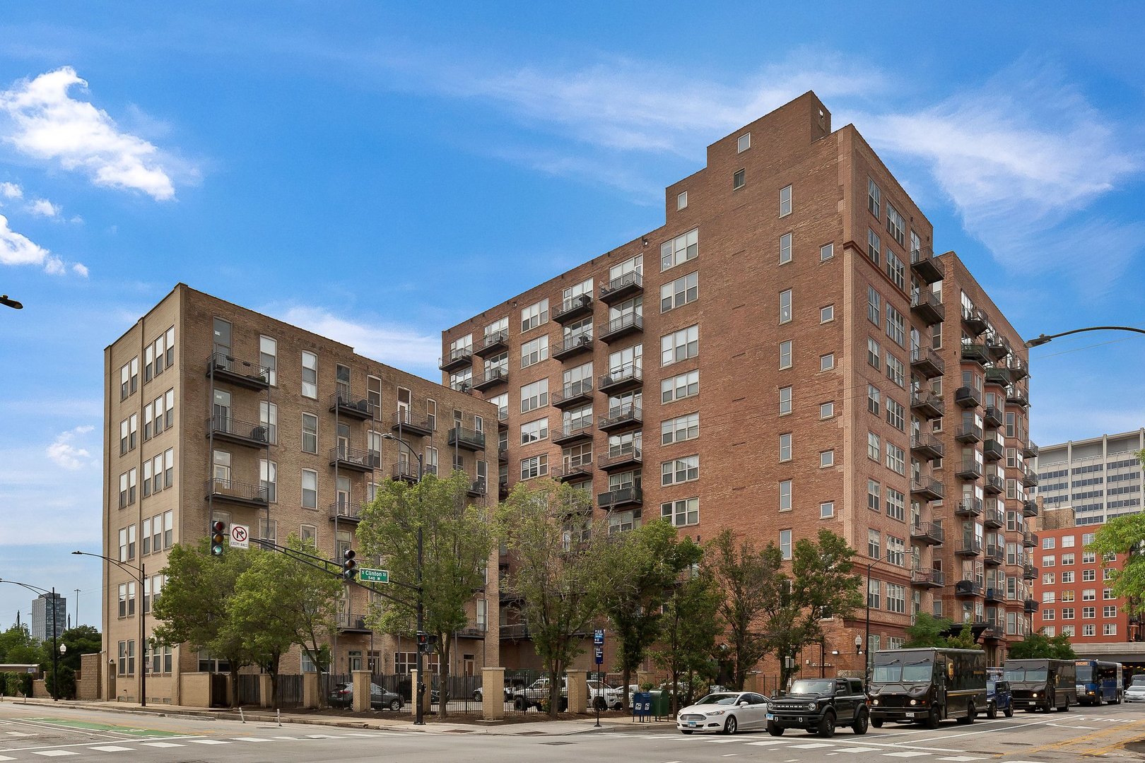 550 West Harrison Street, Unit 353 Chicago, IL 60607 - Photo 1 of 16 a view of a tall building next to a road