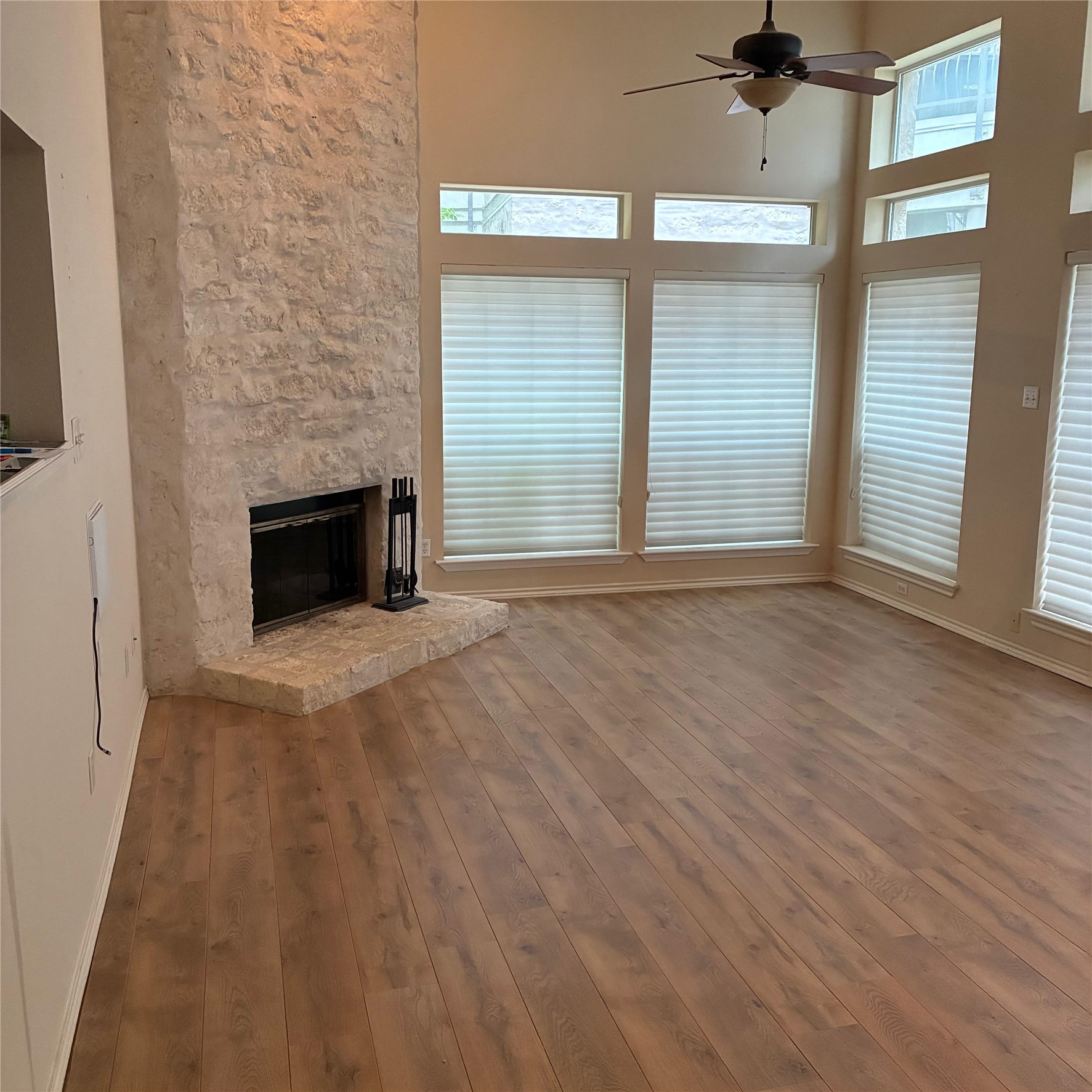 2918 Ranch Road 620, Unit 172 Austin, TX 78734 - Photo 6 of 20 a view of empty room with wooden floor and fan