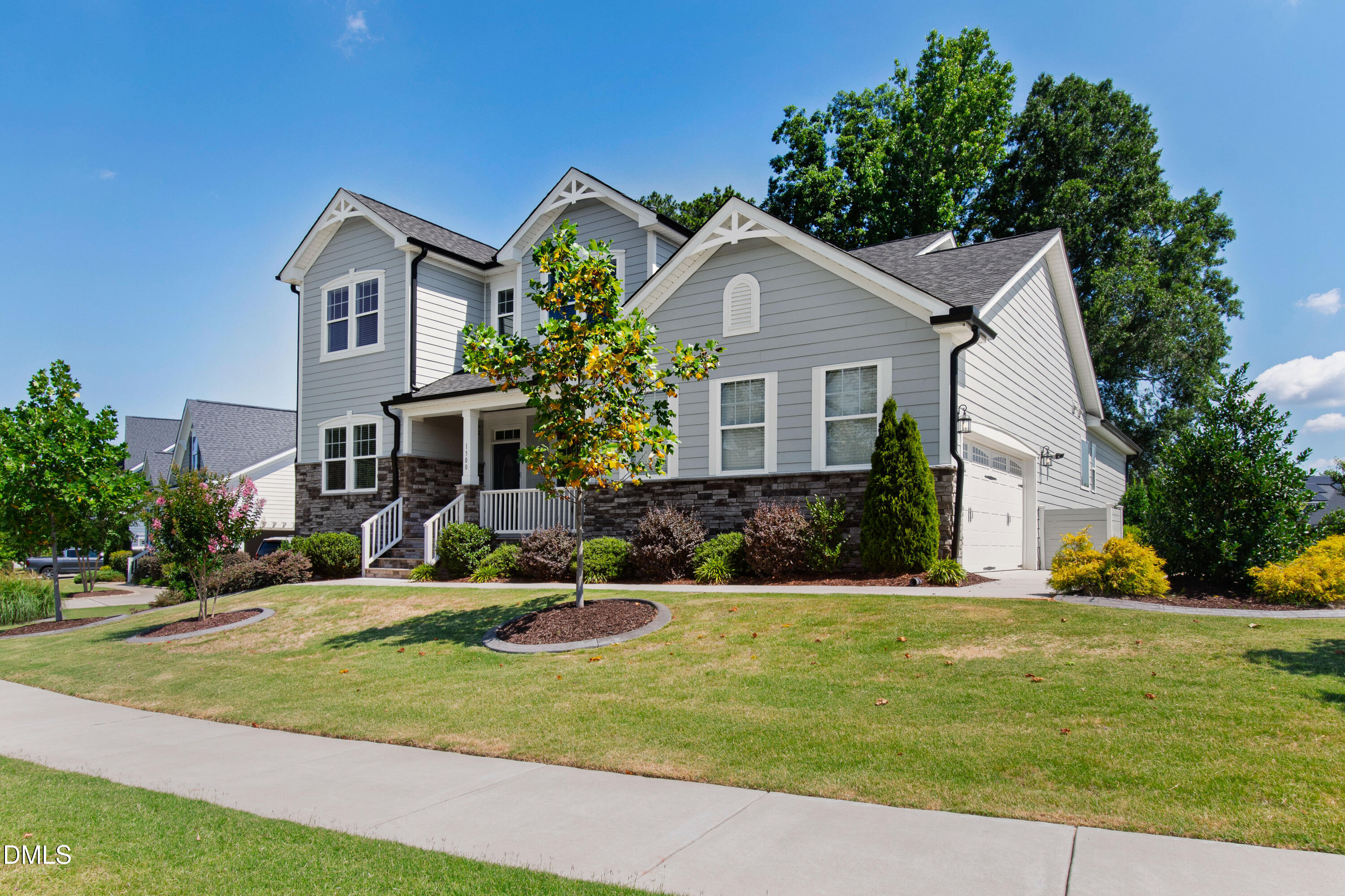 1300 Commons Ford Place Apex, NC 27539 - Photo 65 of 70 a front view of a house with a yard