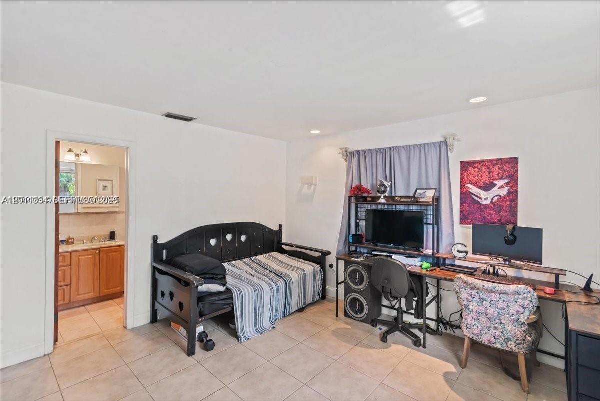 6385 Southwest 25th Street Miami, FL 33155 - Photo 13 of 28 a bedroom with a workspace
