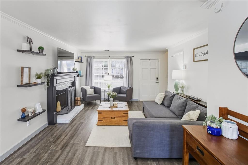 2763 Farmstead Road Smyrna, GA 30080 - Photo 13 of 35 a living room with fireplace furniture and flat screen tv