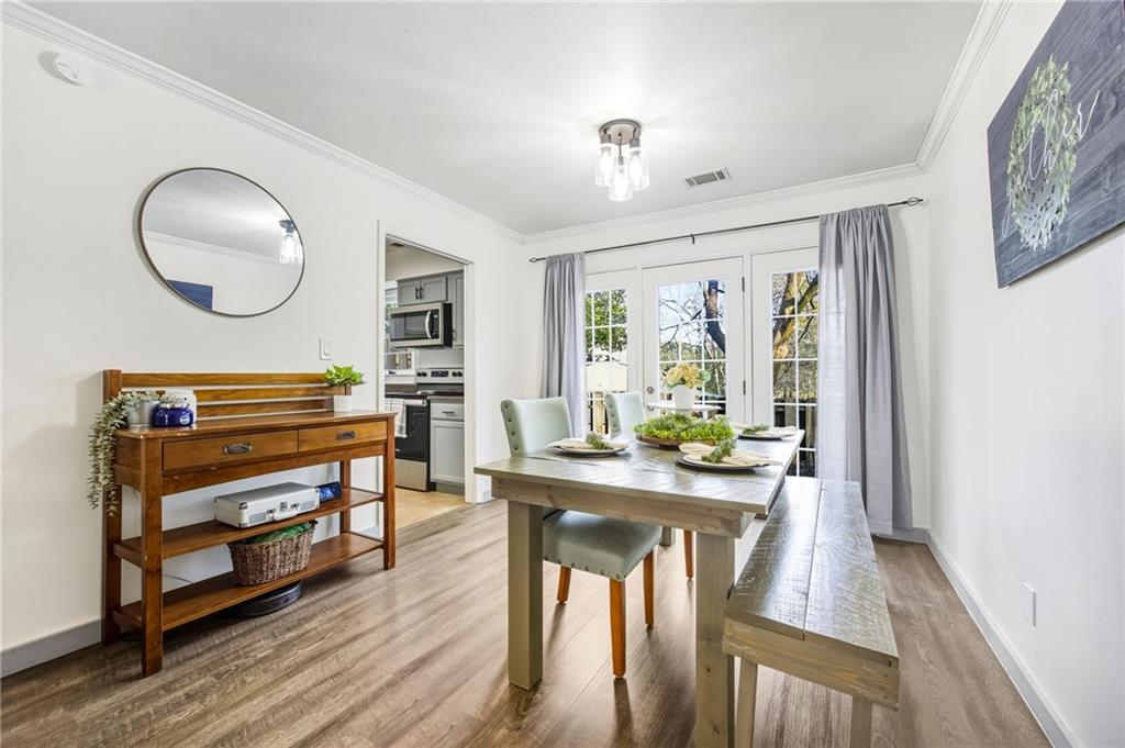 2763 Farmstead Road Smyrna, GA 30080 - Photo 15 of 35 a living room with furniture a window and wooden floor