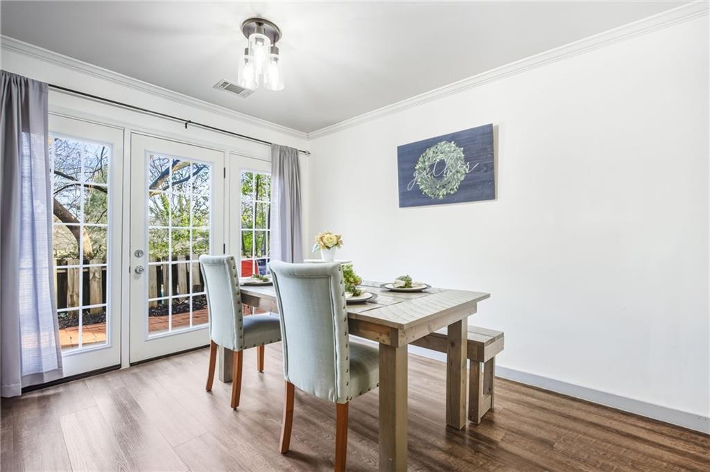 2763 Farmstead Road Smyrna, GA 30080 - Photo 16 of 35 a view of a dining room with furniture window and wooden floor