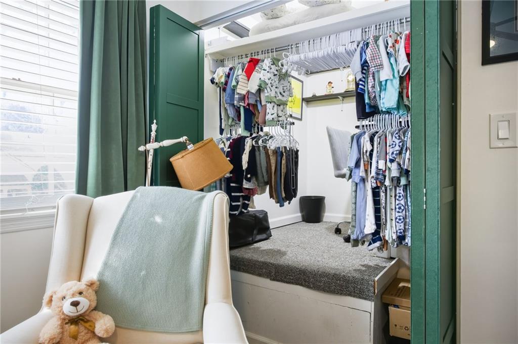 2763 Farmstead Road Smyrna, GA 30080 - Photo 27 of 35 a bathroom with a sink mirror and toilet