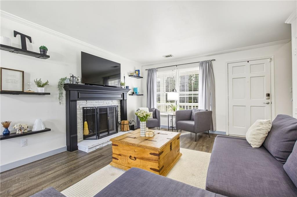 2763 Farmstead Road Smyrna, GA 30080 - Photo 10 of 35 a living room with furniture fireplace and flat screen tv