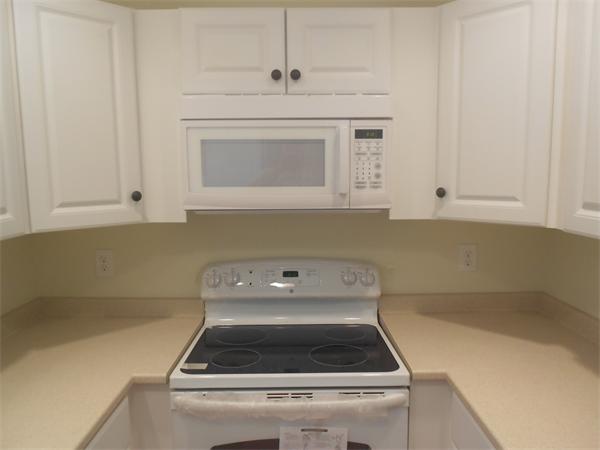 6 Longfellow Road, Unit B Groton, MA 01450 - Photo 11 of 11 a close view of a stove in the kitchen