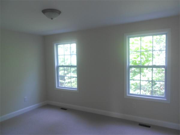 6 Longfellow Road, Unit B Groton, MA 01450 - Photo 3 of 11 an empty room with a window