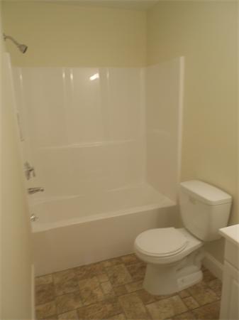 6 Longfellow Road, Unit B Groton, MA 01450 - Photo 7 of 11 a bathroom with a toilet and a shower