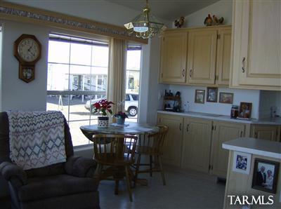 74 Cardinal Corner Benson, AZ 85602 - Photo 20 of 21 a view of a dining room with furniture window and outside view