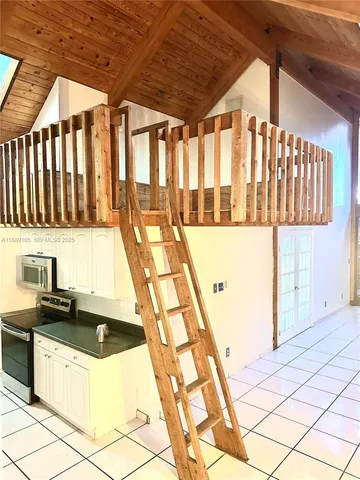 a kitchen with a sink a counter top space and cabinets