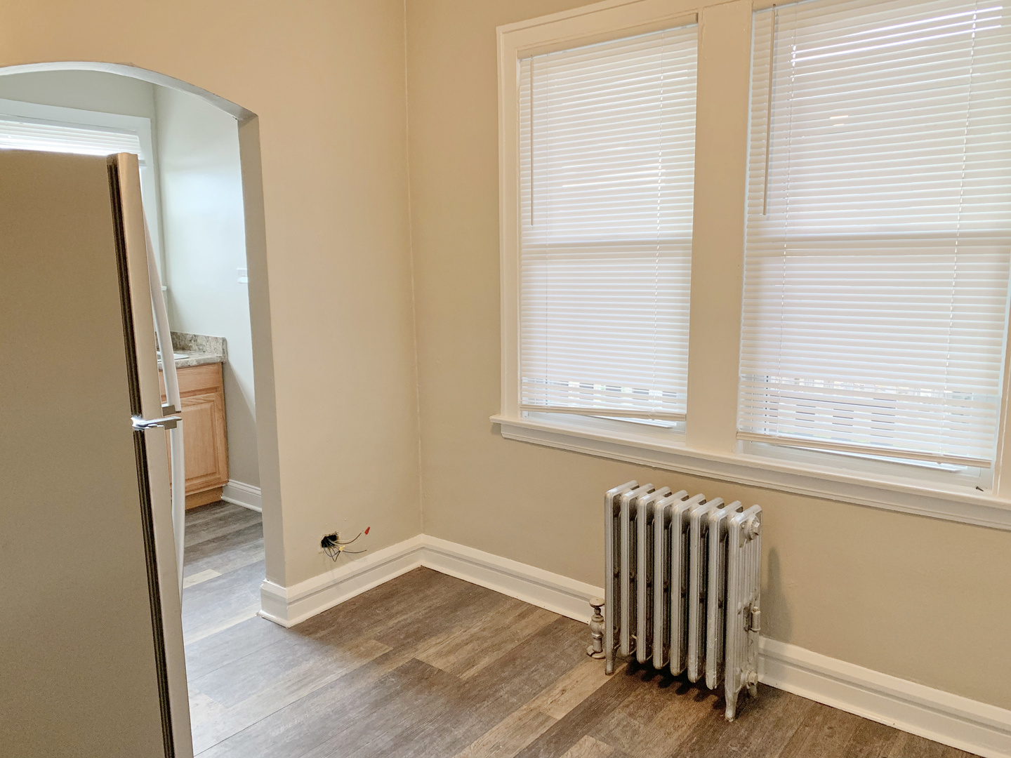 1919 A Grove Avenue, Unit 34 Berwyn, IL 60402 - Photo 19 of 21 an empty room with wooden floor and windows