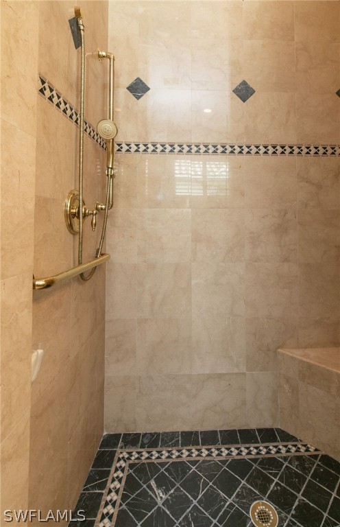 9055 Springview Loop Estero, FL 33928 - Photo 21 of 35 a bathroom with a shower
