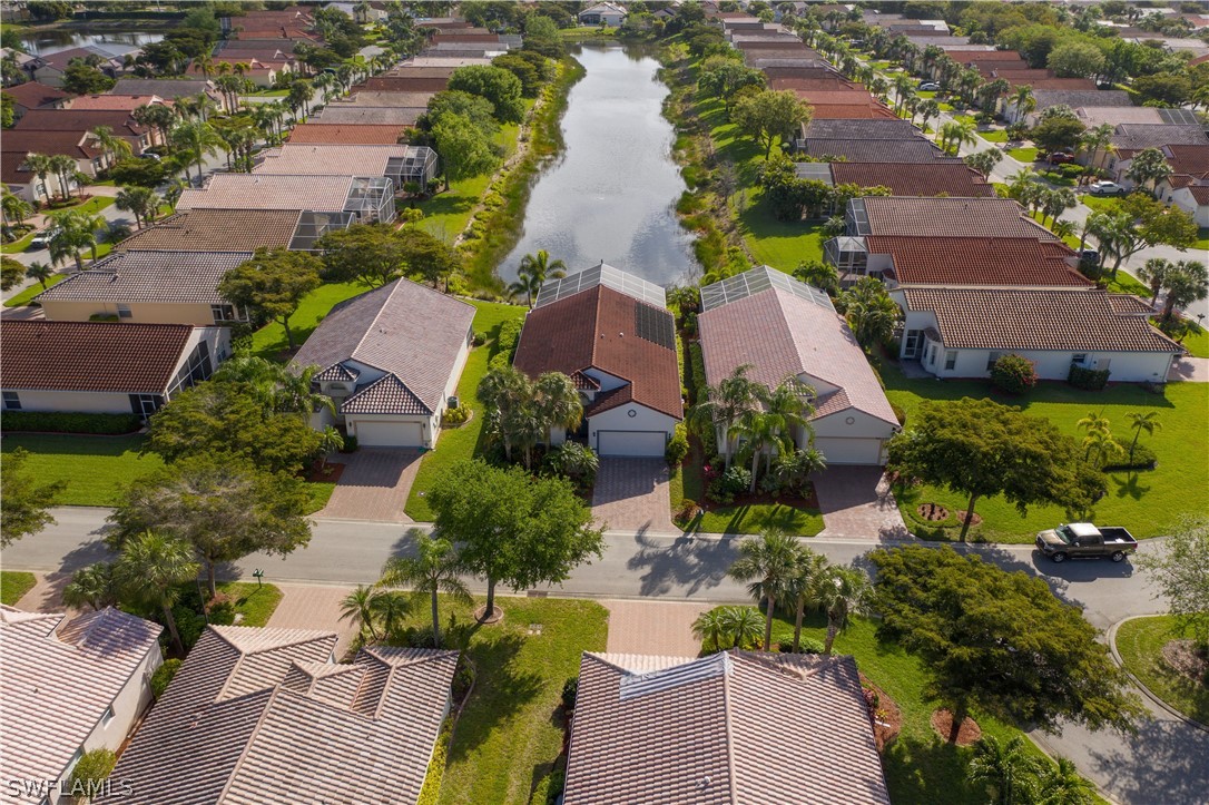 9055 Springview Loop Estero, FL 33928 - Photo 3 of 35 an aerial view of residential houses with outdoor space and swimming pool