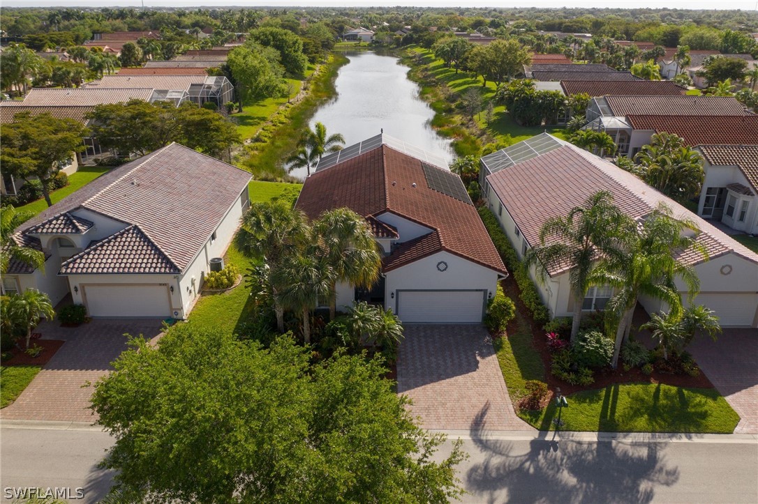 9055 Springview Loop Estero, FL 33928 - Photo 33 of 35 an aerial view of a house with garden space and lake view