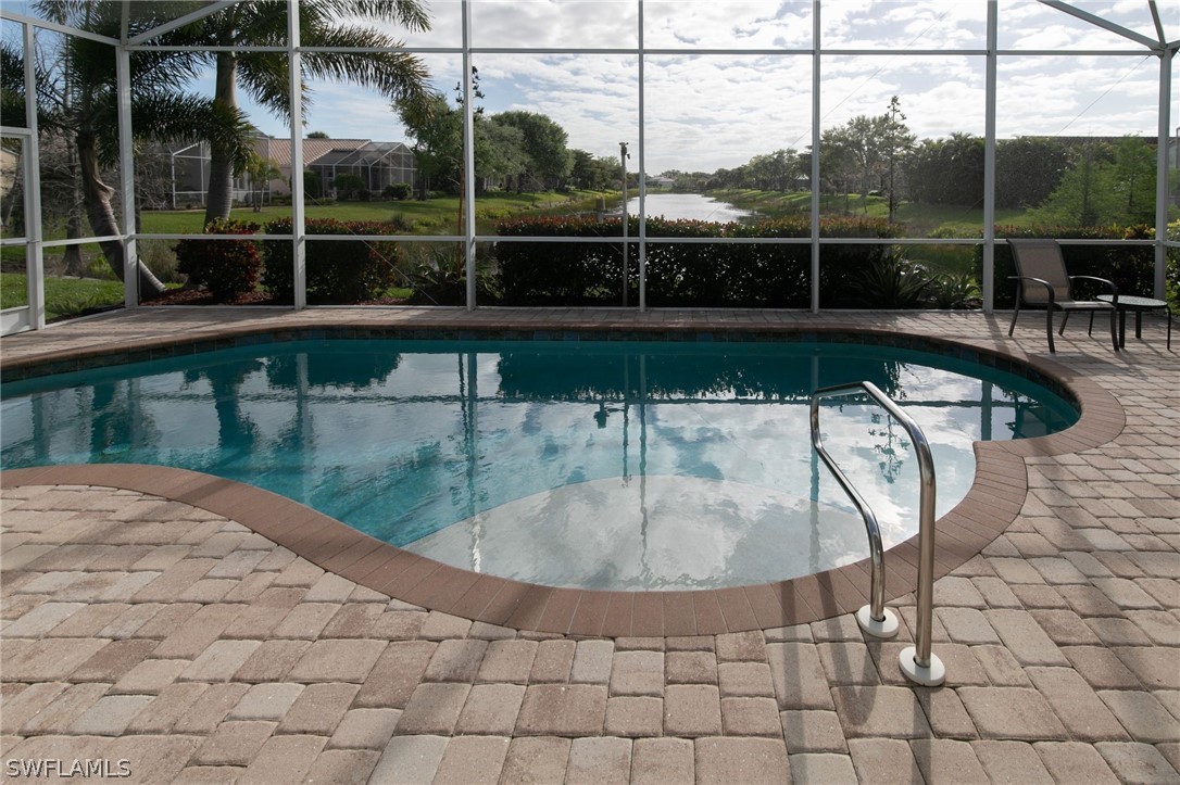 9055 Springview Loop Estero, FL 33928 - Photo 4 of 35 a view of a swimming pool with a porch
