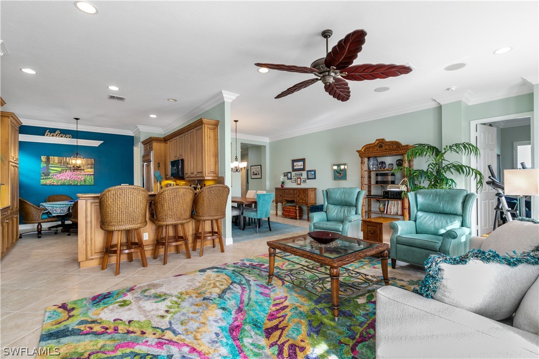 9055 Springview Loop Estero, FL 33928 - Photo 7 of 35 a living room with furniture and a window