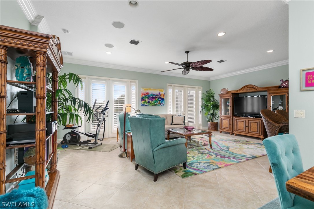 9055 Springview Loop Estero, FL 33928 - Photo 9 of 35 a living room with furniture kitchen view and a large window