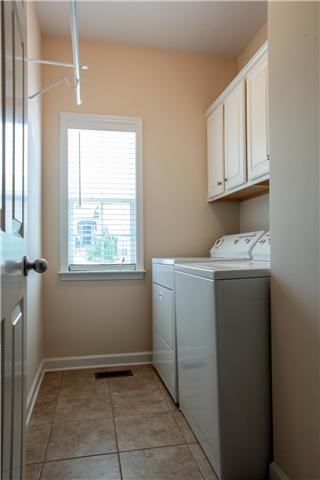 1012 Red Pepper Ridge Spring Hill, TN 37174 - Photo 18 of 20 Laundry Room With Double Cabinets For Storage.