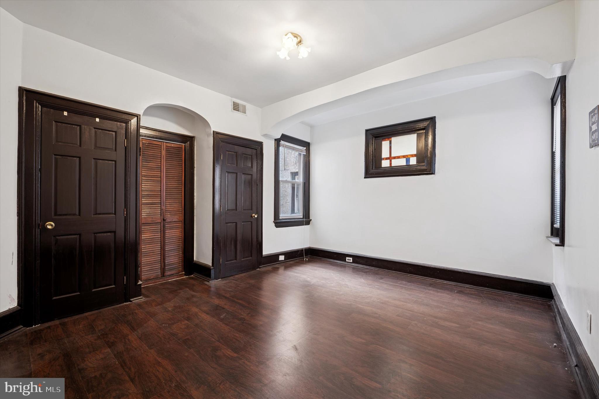 4518 Walnut Street Philadelphia, PA 19139 - Photo 13 of 36 an empty room with wooden floor and closet