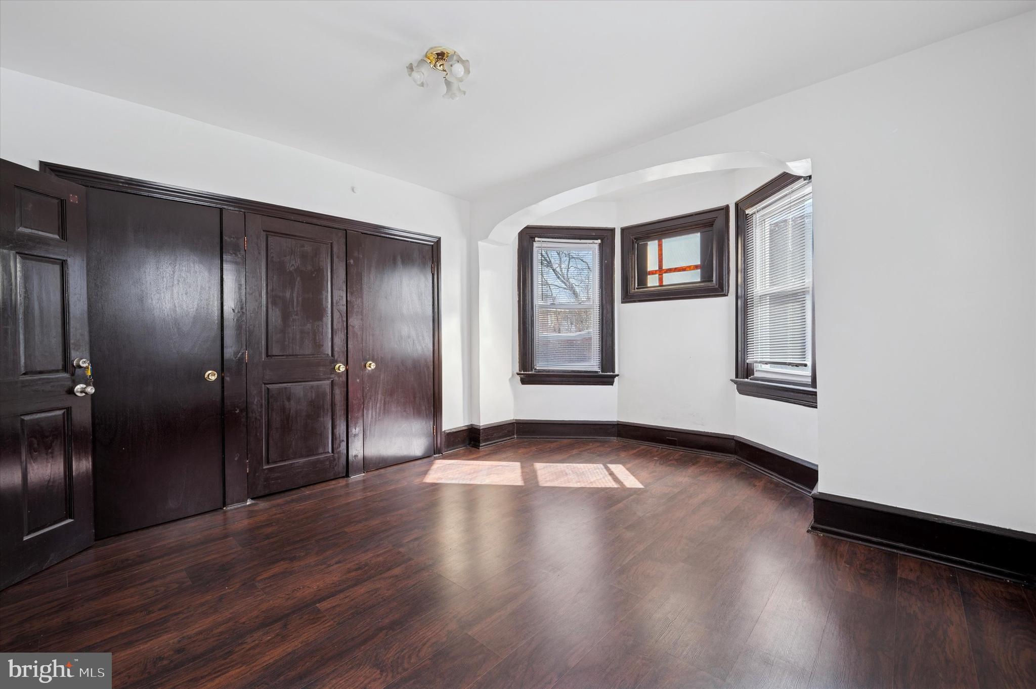 4518 Walnut Street Philadelphia, PA 19139 - Photo 17 of 36 a view of empty room with wooden floor and fan
