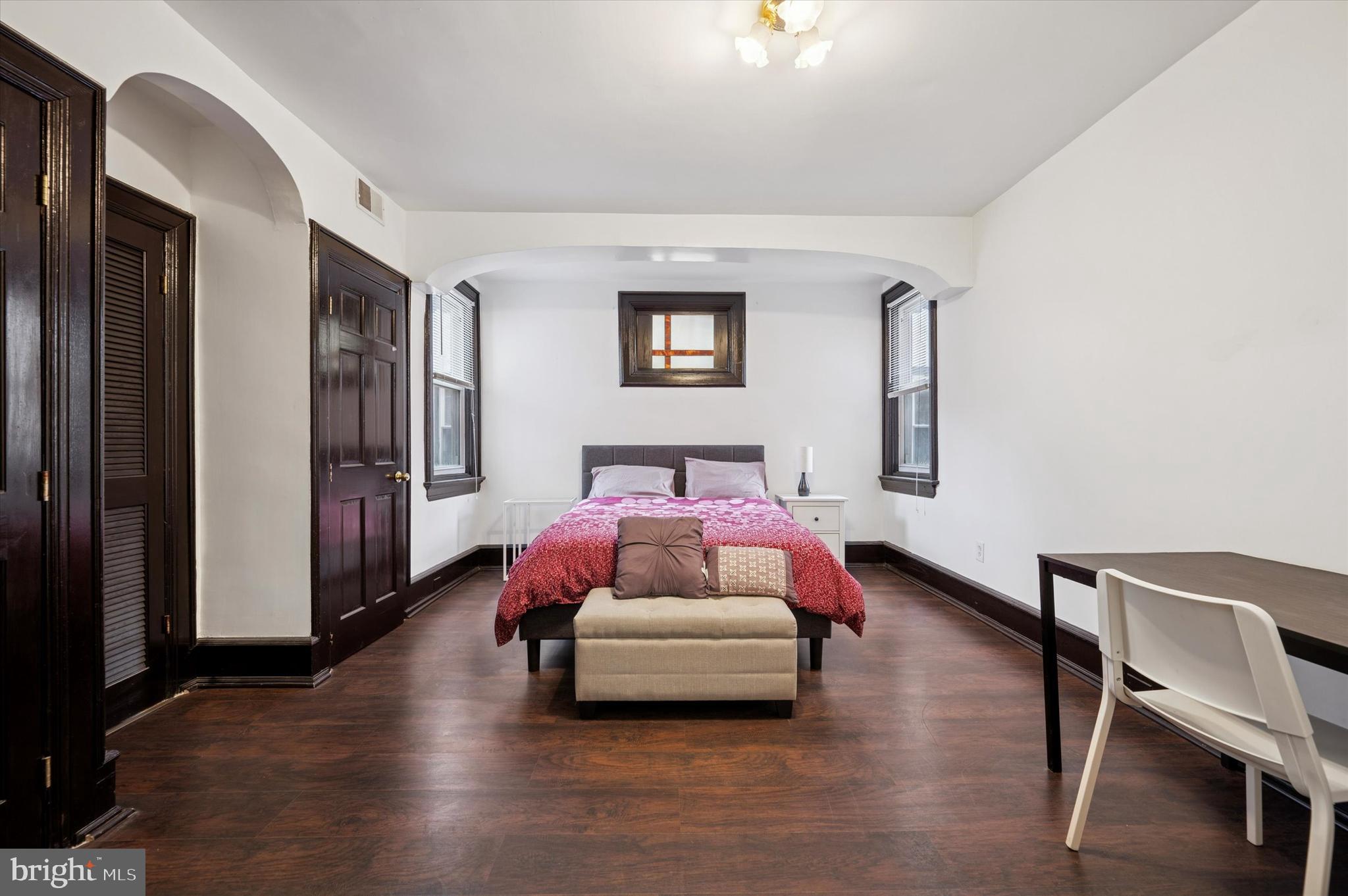 4518 Walnut Street Philadelphia, PA 19139 - Photo 21 of 36 a bedroom with a bed and a chair