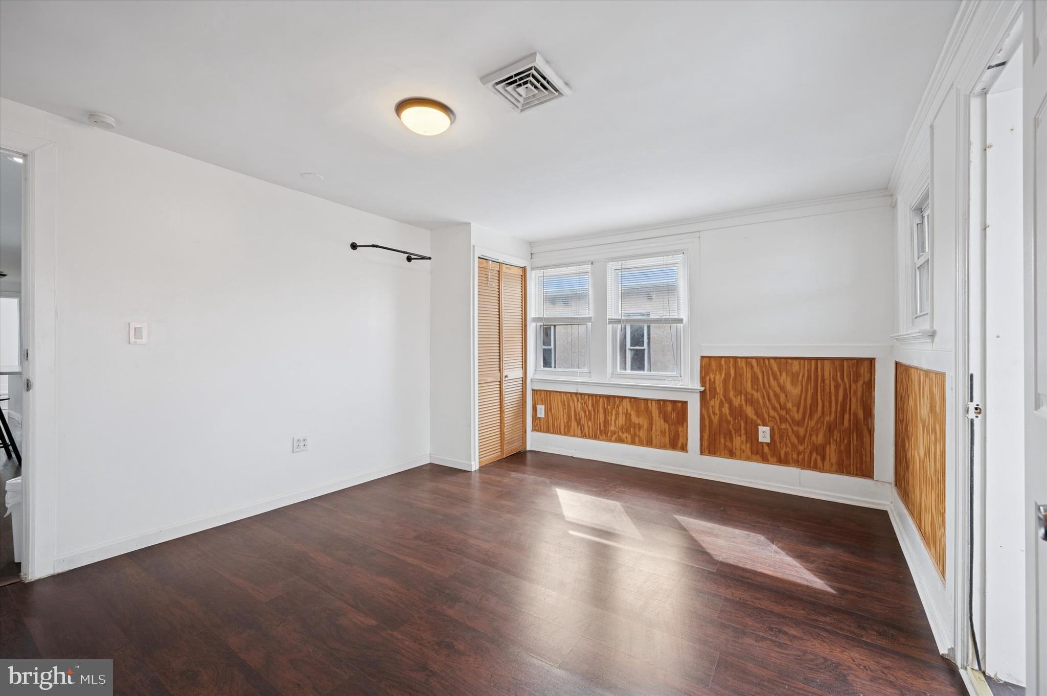 4518 Walnut Street Philadelphia, PA 19139 - Photo 27 of 36 a view of an empty room with wooden floor and a window
