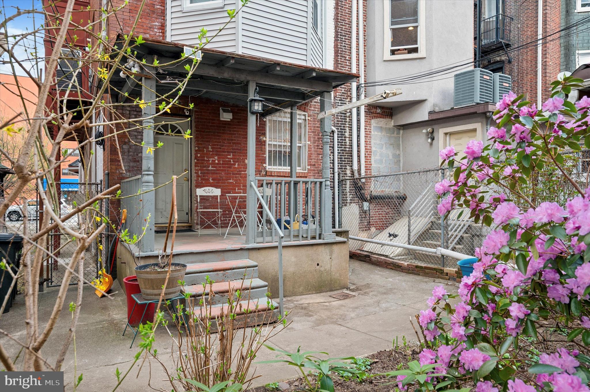 4518 Walnut Street Philadelphia, PA 19139 - Photo 35 of 36 a view of patio with a table and chairs and potted plants