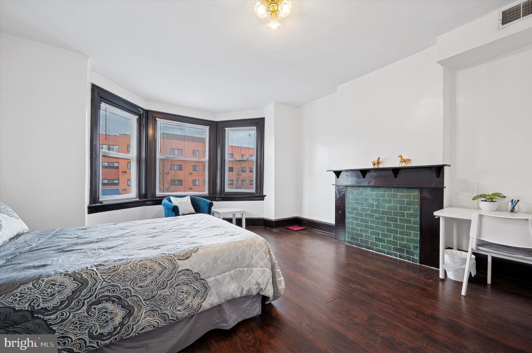 4518 Walnut Street Philadelphia, PA 19139 - Photo 10 of 36 a spacious bedroom with a bed and a window