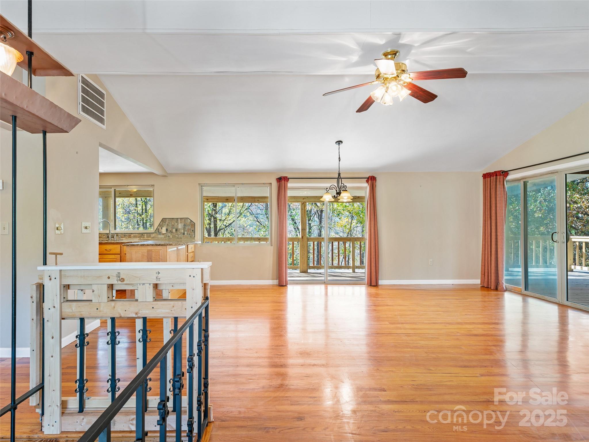 19 Old Patton Hill Road Swannanoa, NC 28778 - Photo 11 of 44 a view of an empty room with wooden floor and a window