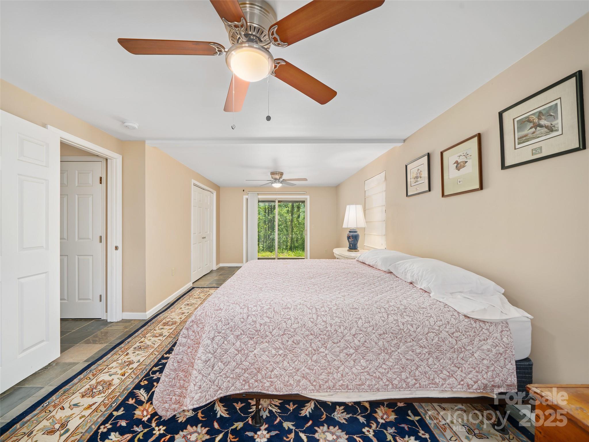 19 Old Patton Hill Road Swannanoa, NC 28778 - Photo 18 of 44 a bedroom with a bed and a large window