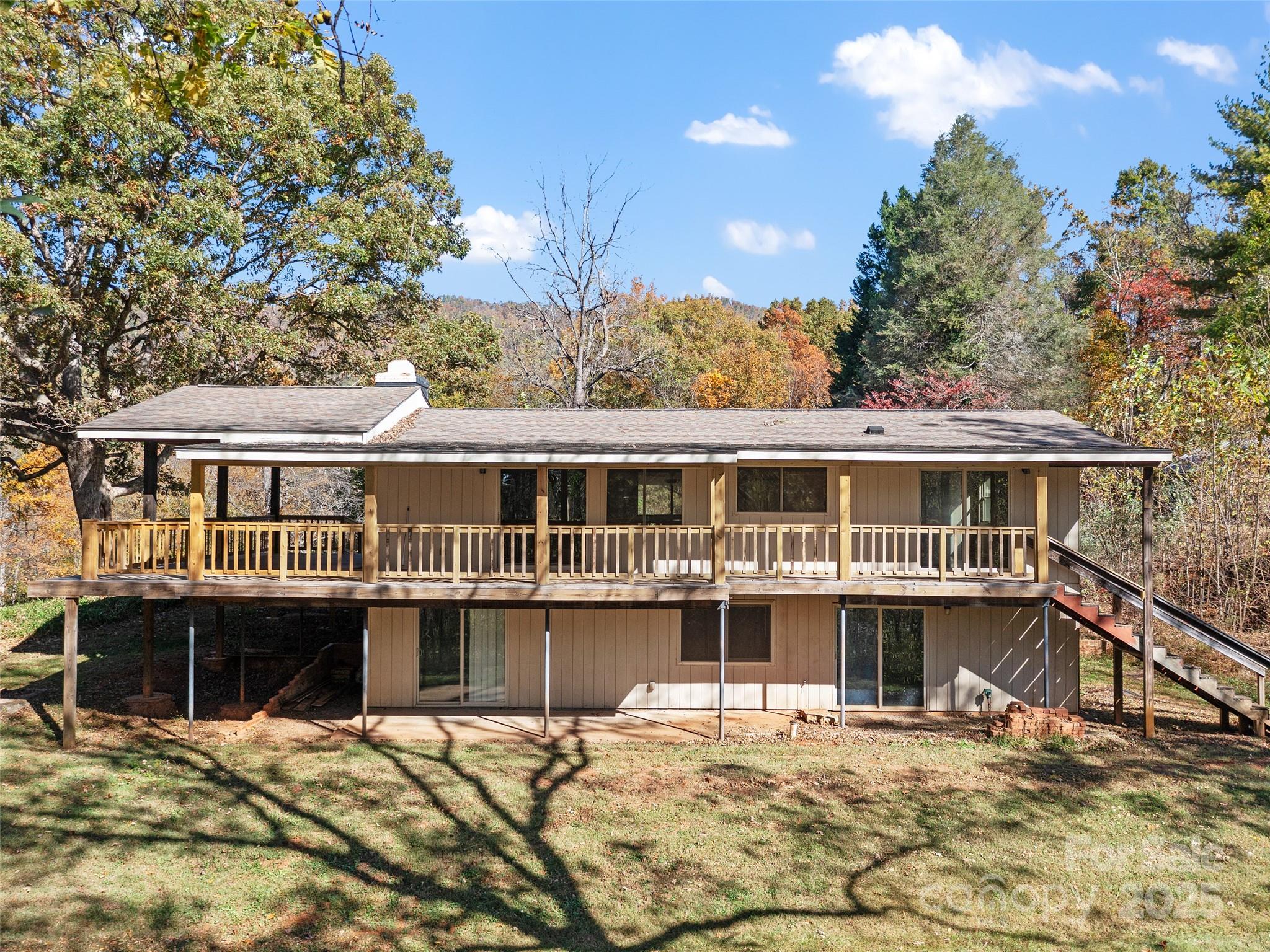 19 Old Patton Hill Road Swannanoa, NC 28778 - Photo 3 of 44 a large house with a large window and wooden fence