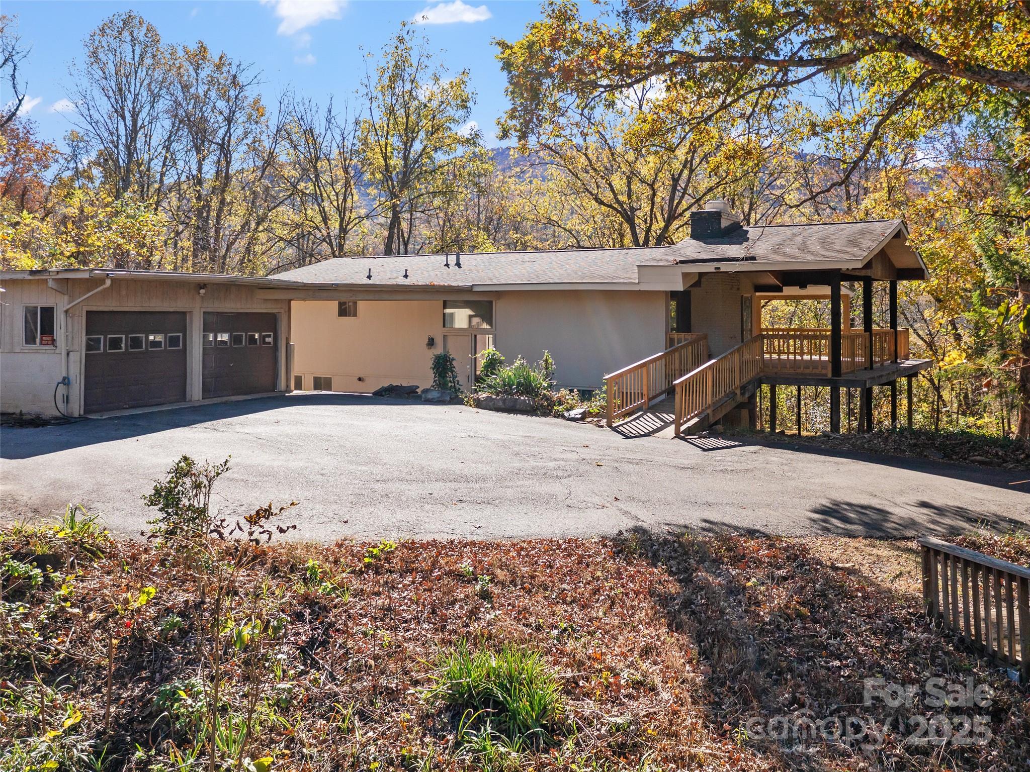 19 Old Patton Hill Road Swannanoa, NC 28778 - Photo 44 of 44 a front view of a house with a yard and garage